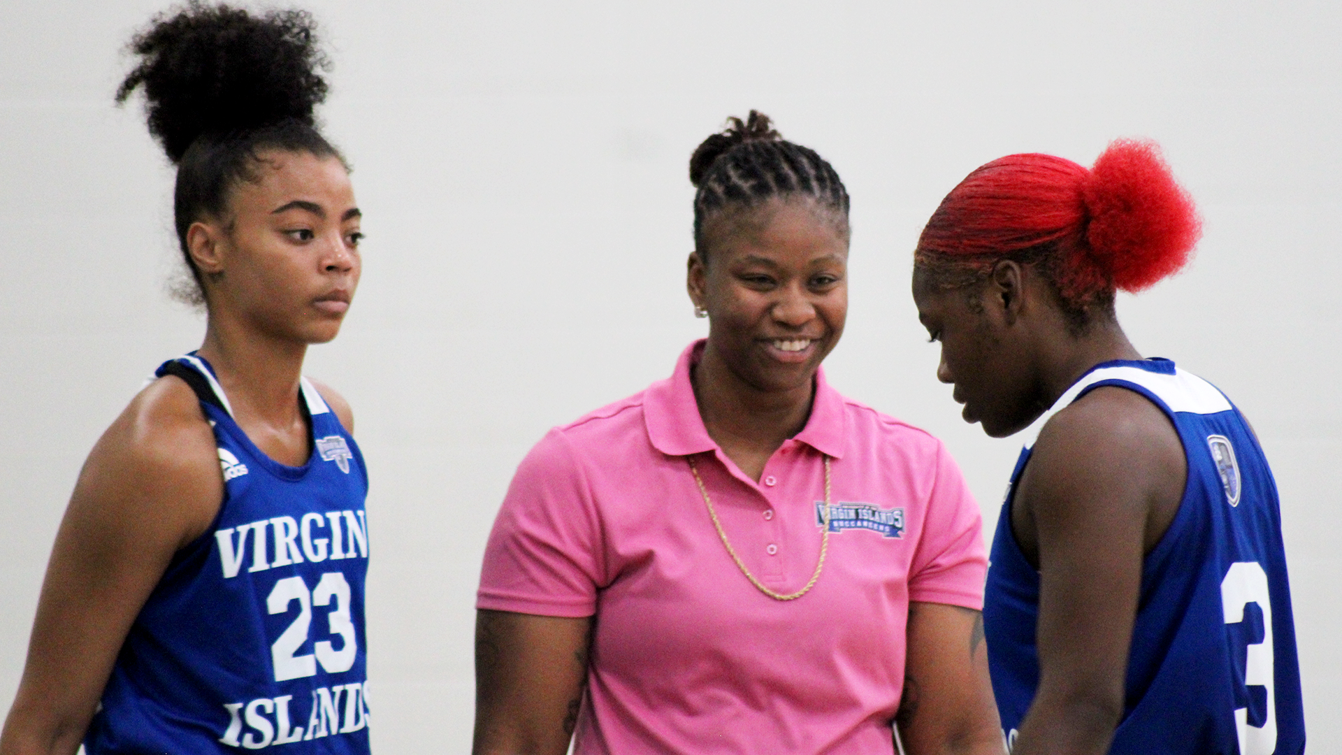 Head Coach Collins is smiling as Mia Davis substitutes out of the game for Kaya Evans.